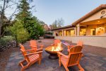 Peaceful fire pit setting with red rock views